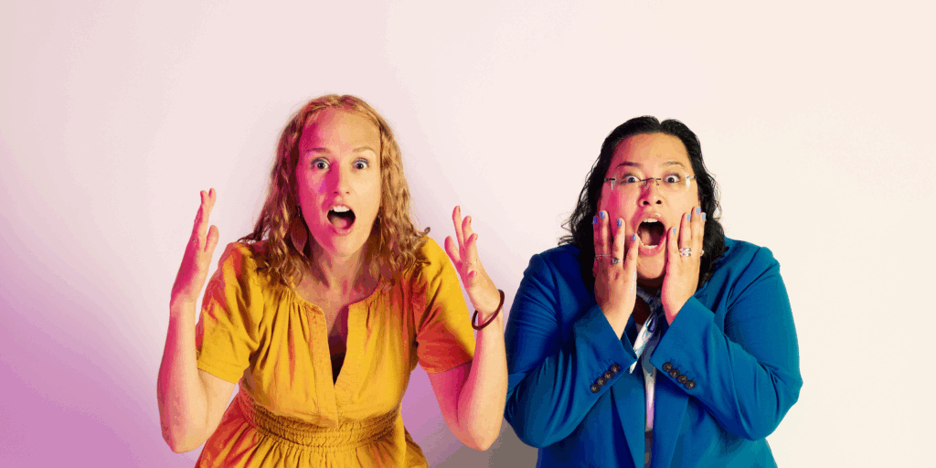 two excited artists with mouths open gasping at the camera