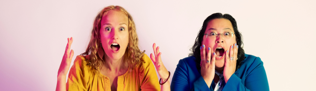 two excited artists with mouths open gasping at the camera