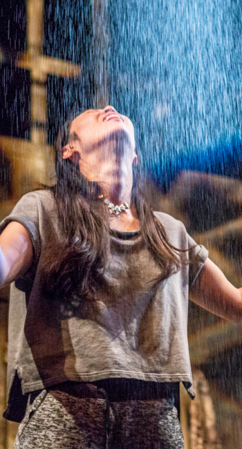 woman smiles under the rain